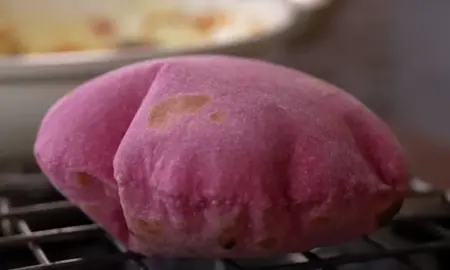 preparing the beetroot roti