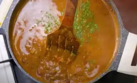 adding cream and butter and garnishing it with coriander