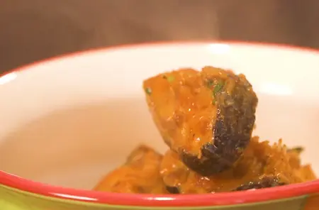 Finished Methi Fish Curry served in a bowl, garnished with coriander.