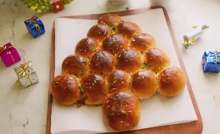 Baked buns with golden shine and butter glaze ready to be served