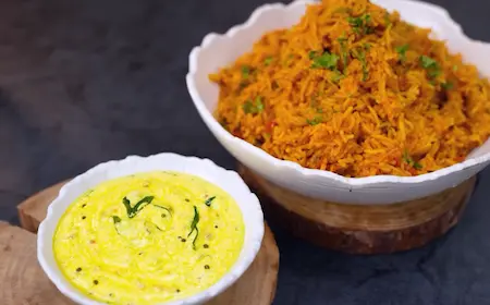 Serving tomato rice with ginger pachadi on a plate