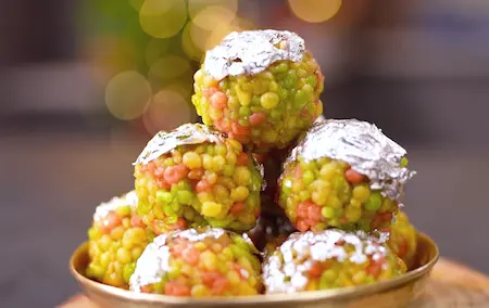 Tightly packed colorful boondi ladoos ready to serve