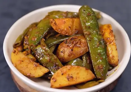 Achar wale aloo sem served on a plate