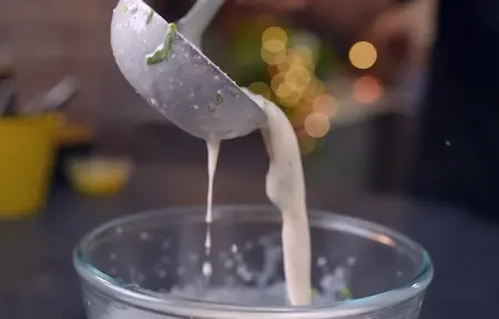 Masala Buttermilk being whisked and served chilled in a bowl