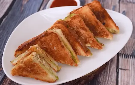 Step 5: serving hot Paneer Crispy Sandwich with chutney and ketchup