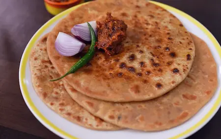 Step 6: serving Sattu Ka Paratha with garlic red chilli chutney