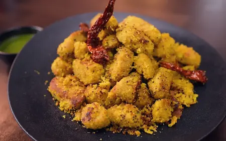 Step 8: Serving hot Dudhi Muthiya with green chutney — traditional Gujarati snack