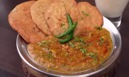 Serving crispy Aligarh Kachori with spicy aloo sabzi and chilled chass for a classic Aligarh-style meal