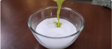 Mixing semolina and yogurt for the dhokla batter.