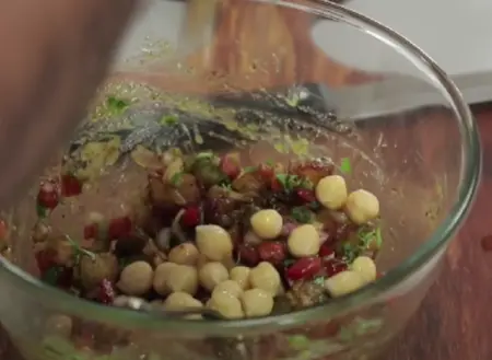 Chaat mixture with coriander, green chilli, onions, tomatoes, and spices.