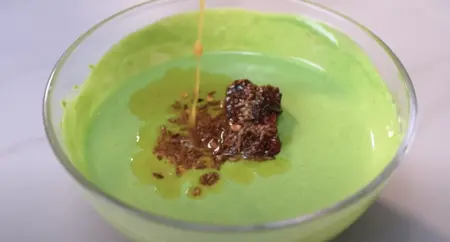 Tadka preparation with cumin seeds, dried red chilli, and asafoetida frying in ghee.for raita