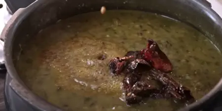 Tadka preparation with cumin seeds, dried red chilli, and asafoetida frying in ghee. for dal saag