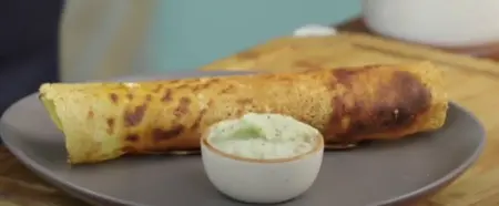 Crispy masala dosa served hot with coconut chutney.