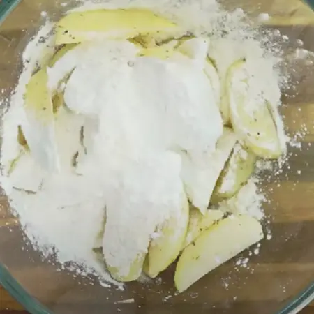 Potatoes cut into finger-shaped pieces seasoned with cornflour, salt, pepper, and red chilli powder.