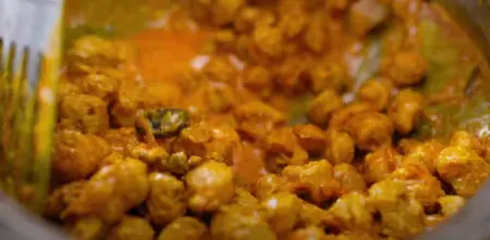 Soya chunks simmering in a rich biryani gravy with spices.