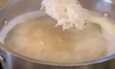 Boiling rice for Chicken Biryani.