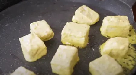 shallow fry the marinated paneer cubes until golden brown on all sides