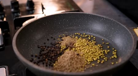 Ground black chaat masala made with coriander, jeera, and other spices.