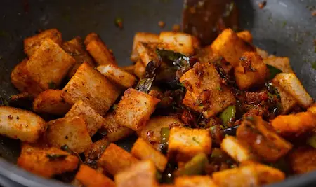 Toasted bread mixed with masala and garnished with fresh coriander.