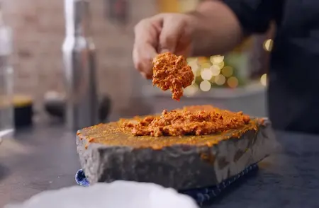 Preparing spicy peanut chutney for Methi Wada