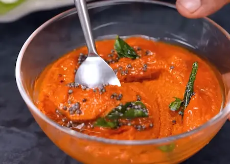 Combining tadka with red coconut chutney