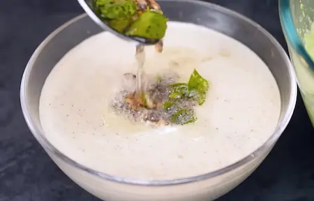 Pouring tadka over the coconut chutney