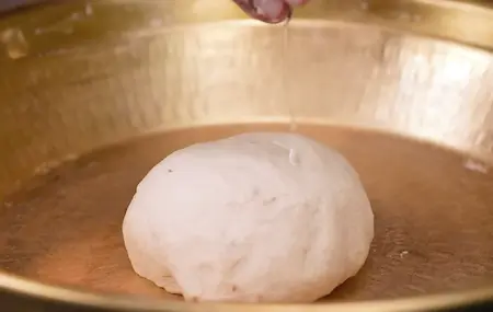 Preparing dough for Pinwheel Aloo Paratha