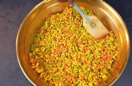 Cooling boondi mixture spread on a large plate