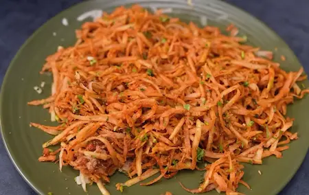 Sambario and fried mirchi prepared as a side dish with fresh papaya salad and chillies