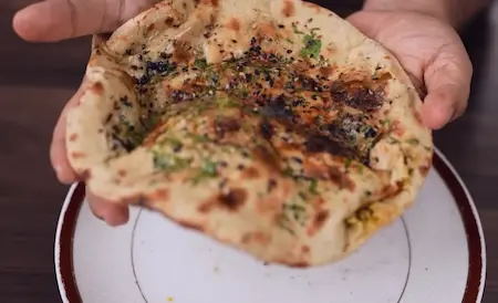 Step 8: buttering Paneer Matar Kulcha