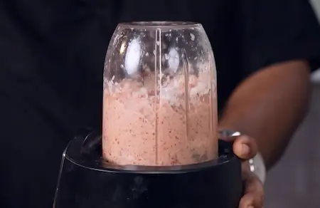 Grinding peanut coconut chutney for serving with Udid Daliche Vade recipe