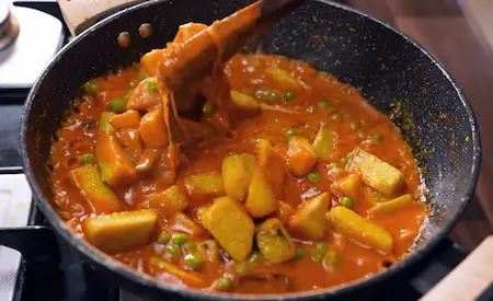 Step 6: cooking shallow fried suran in gravy for Suran ki Sabji Recipe