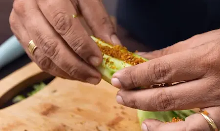 Step 4: Filling turai pieces generously with peanut-coconut masala for Bharwa Turai