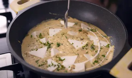 Step 7: Adding fresh cream for the final finish of Paneer Kasuri Methi