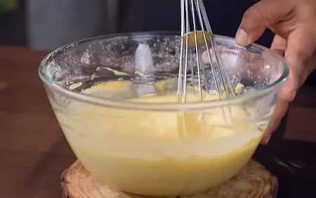 Step 2: whisking batter to aerate Soft & Spongy Market Style Khaman Dhokla Recipe