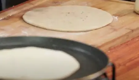 rolling out the paratha