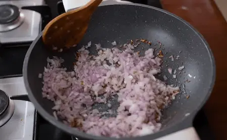 Onion and spice mixture cooking for curry gravy.