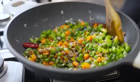 Cooking vegetables for Seviyan Upma