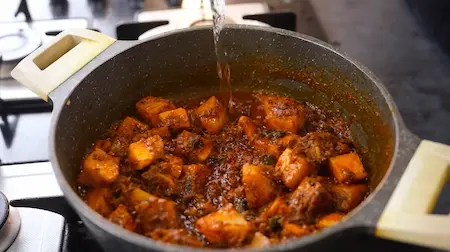 Sautéing potatoes with masala for Spicy Aloo Sabji