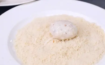 Mushrooms coated with batter and breadcrumbs.