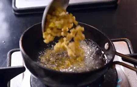 Adding ginger and spices to the tempering for pachadi