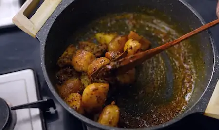 Adding spices and peas