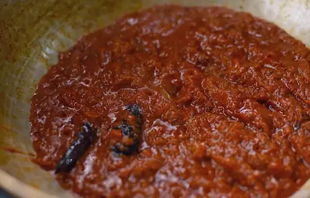 Tomato puree cooking in the pan