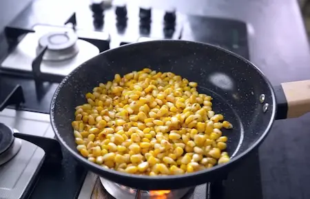 Step 1: sautéing corn for corn masala sabzi