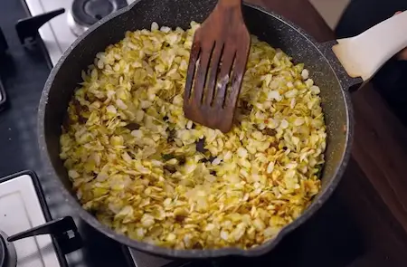 Step 3: adding and roasting poha for Poha Chiwda Recipe