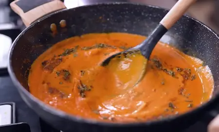 Step 6: adding spices to Dhaba Style Matar Paneer gravy