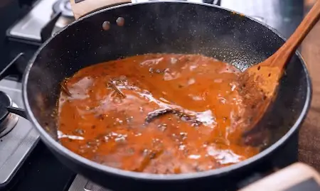 Step 5: simmering gravy to adjust consistency for Papad ki Sabji Recipe