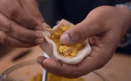 Step 4: stuffing sattu filling inside paratha dough
