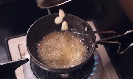 Step 8: Preparing ghee tadka with jeera garlic and red chilli powder for Chana Soya Ki Sabji