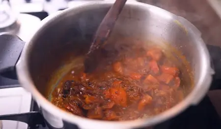 Step 6: Cooking tomato masala with spices for Pressure Cooker Mushroom Masala